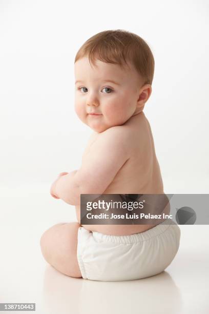 serious caucasian baby boy - nappy stock pictures, royalty-free photos & images