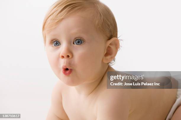 curious caucasian baby boy - baby pout stock pictures, royalty-free photos & images