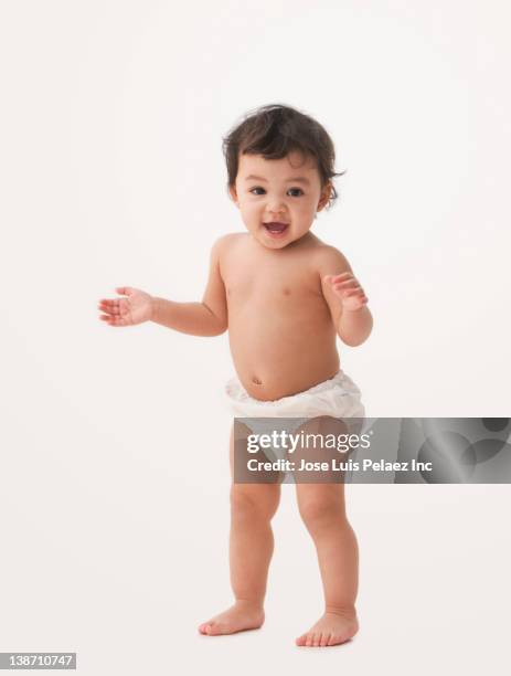 smiling mixed race baby girl - baby diaper stockfoto's en -beelden