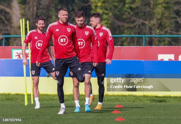 Chris Gunter followed by Ben Davies, Aaron Ramsey and Joe Allen of Wales during a FAW training session ahead of their 2022 FIFA World Cup Qualifier...