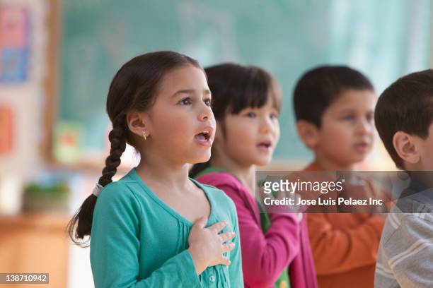 students saying the pledge of allegiance in classroom - oath stock pictures, royalty-free photos & images