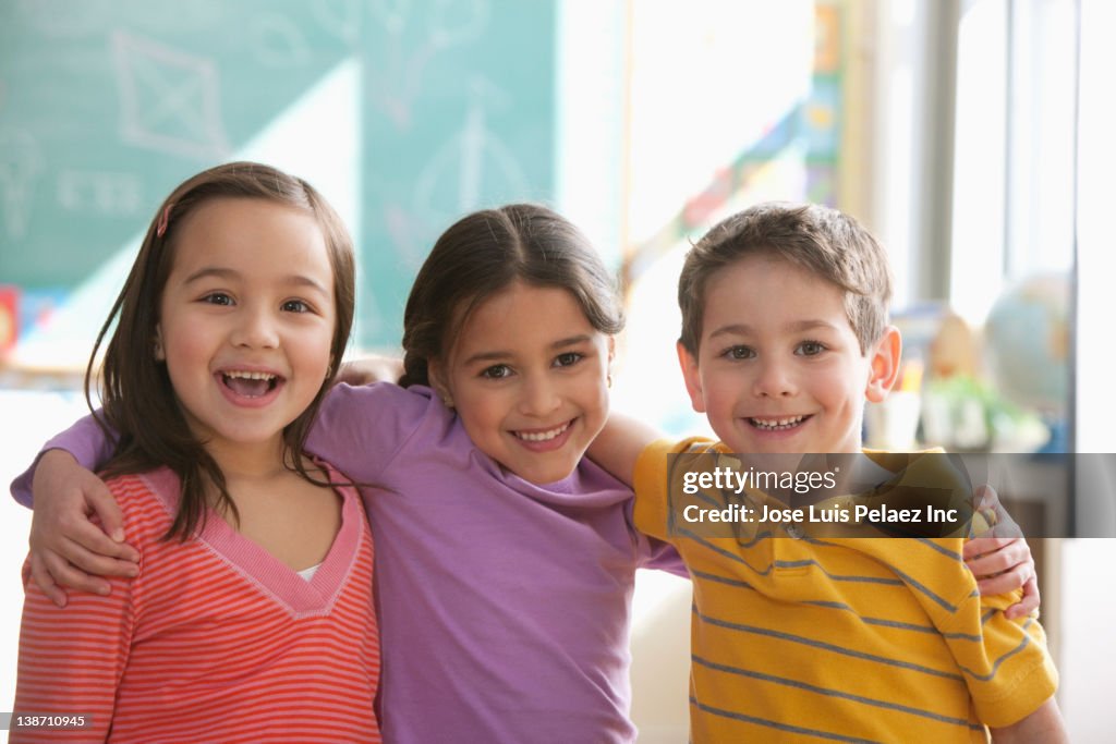 Students standing together in classroom
