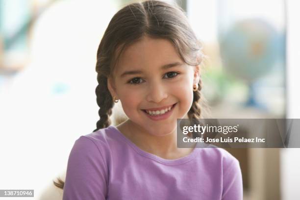 smiling hispanic girl - girl with brown hair stock pictures, royalty-free photos & images