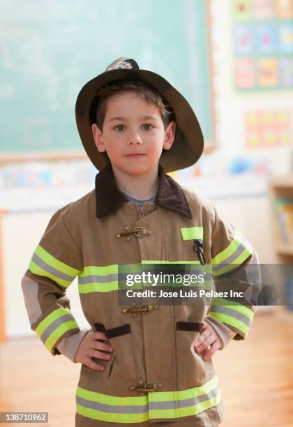 caucasian boy dressed as fireman - child fireman stock pictures, royalty-free photos & images