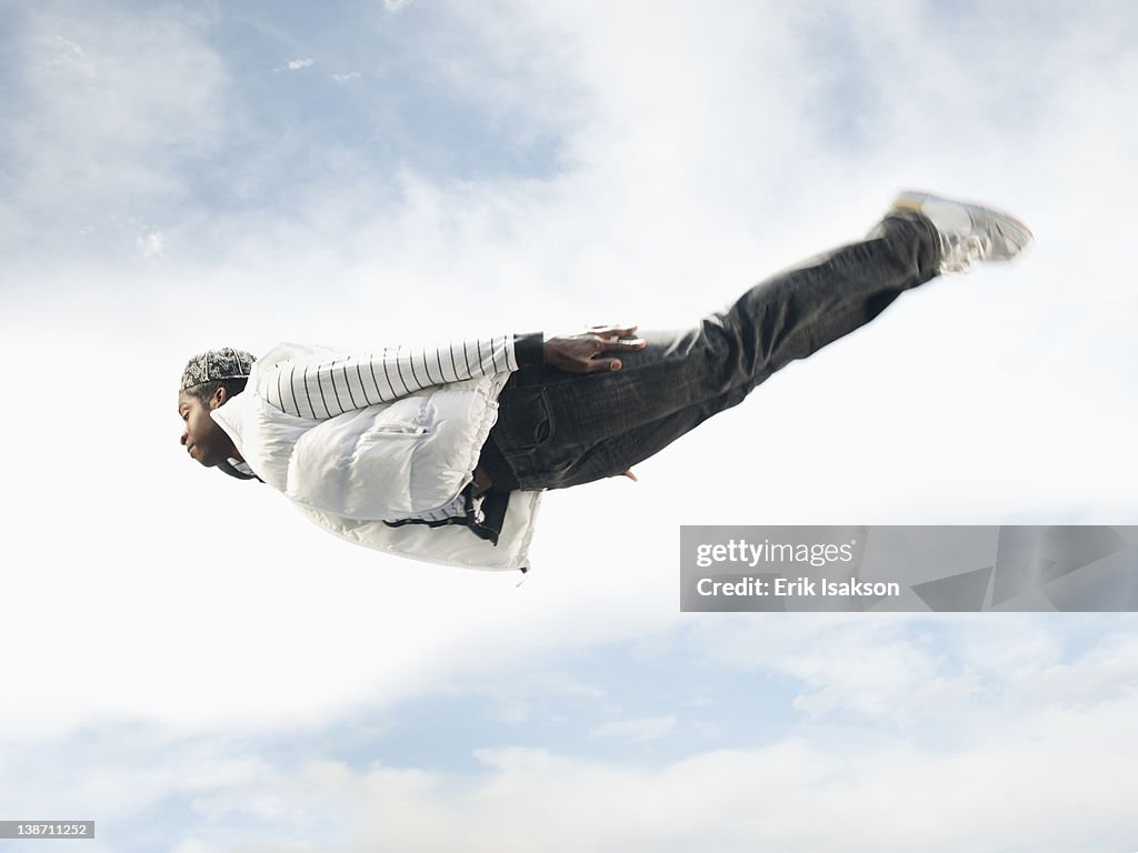 African American man flying through mid-air