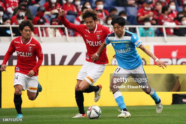 Yuki Otsu of Jubilo Iwata and Atsuki Ito of Urawa Red Diamonds compete for the ball during the J.LEAGUE Meiji Yasuda J1 5th Sec. Match between Urawa...