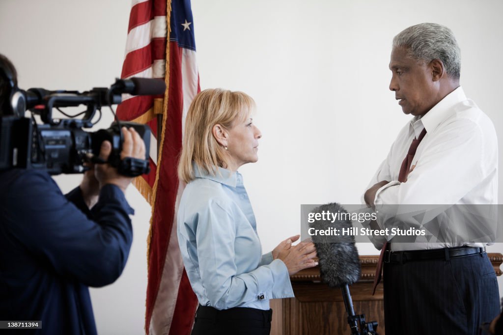 News reporter interviewing politician on camera