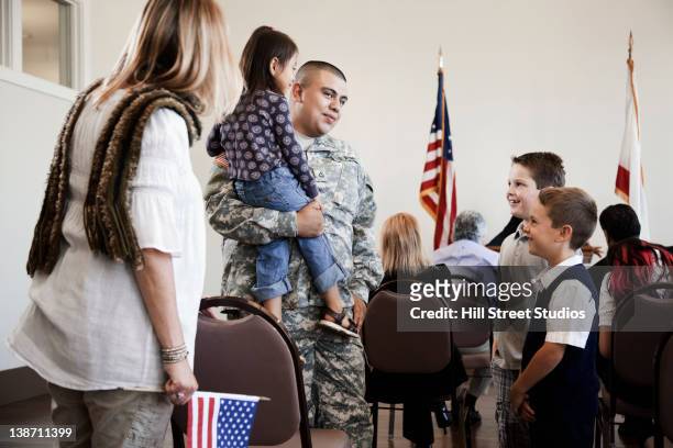children talking to soldier at political gathering - american flag on stand stock pictures, royalty-free photos & images