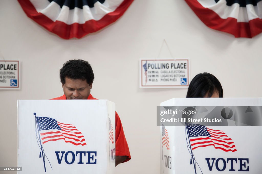 Voters voting in polling place