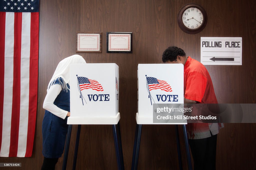 Voters voting in polling place