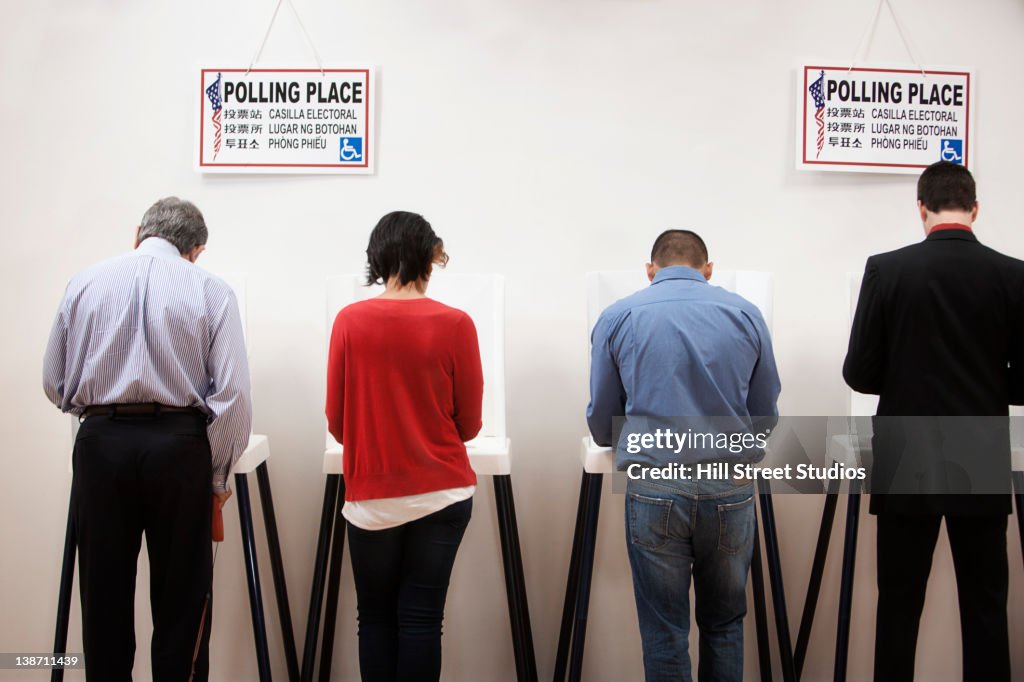 Voters voting in polling place