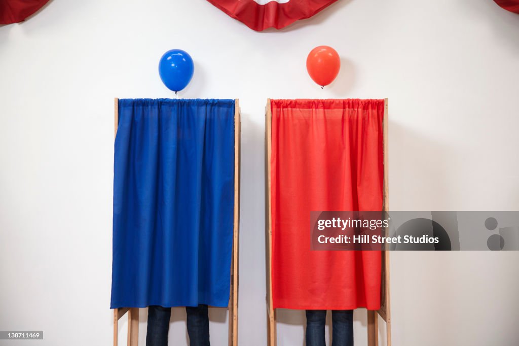 Voters voting in polling place