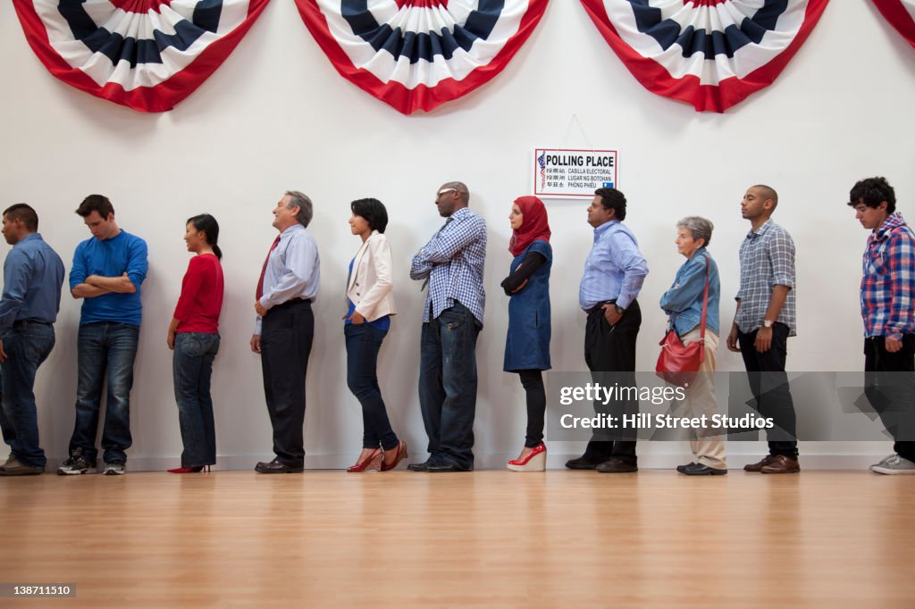 Voters waiting to vote in polling place
