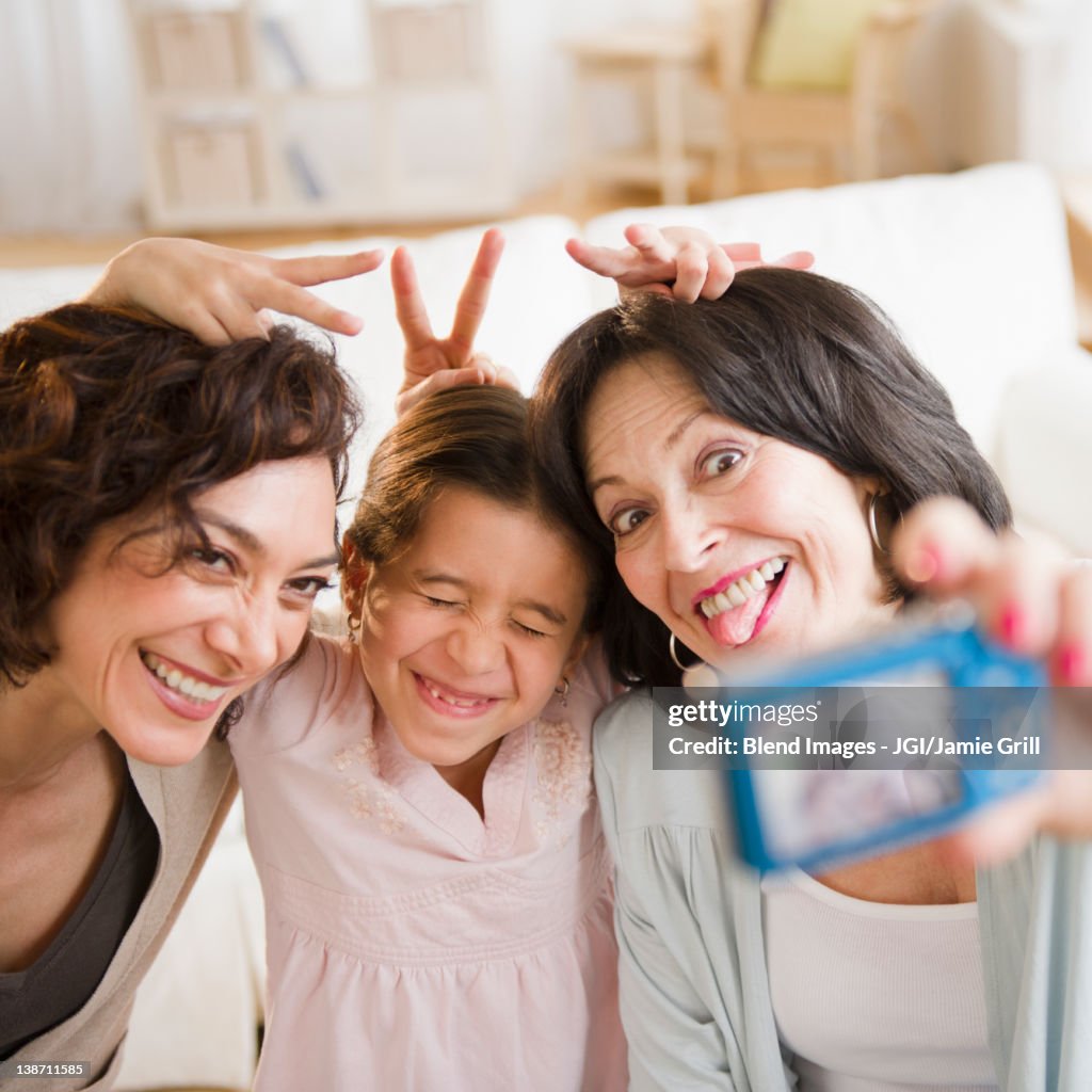 Family taking self-portrait with digital camera