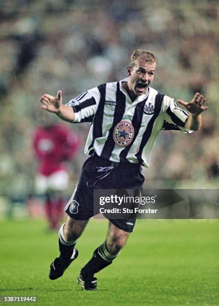 Newcastle United striker Alan Shearer celebrates after scoring the second Newcastle goal and his first for the club with his trademark one armed...