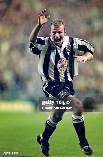 Newcastle United striker Alan Shearer celebrates after scoring the second Newcastle goal and his first for the club with his trademark one armed...