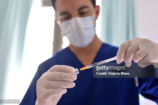 nurse preparing a vaccine - argentina covid stock pictures, royalty-free photos & images