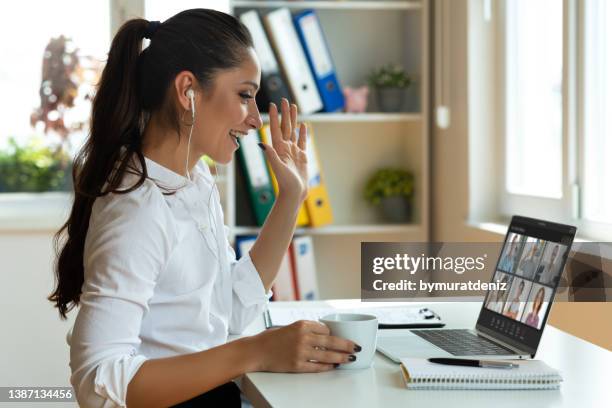 woman in a video conference - virtual teamwork stock pictures, royalty-free photos & images