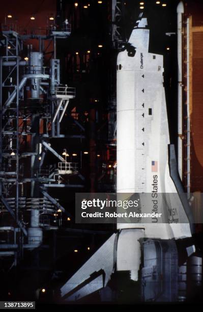 The Space Shuttle Challenger sits on the launch pad at Kennedy Space Center in Florida the night before it took America's first female astronaut,...