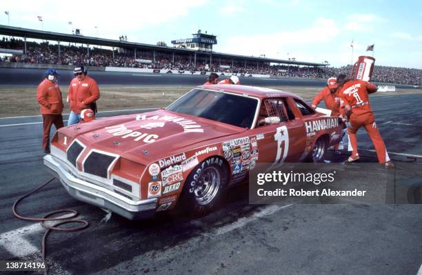 Driver Donnie Allison, driving the No. 1 Hawaiian Tropic car, makes a pit stop during the 1980 Daytona 500 at the Daytona International Speedway in...
