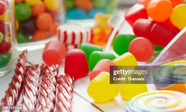 close-up of an assortment of colorful candies - candy jar stock pictures, royalty-free photos & images