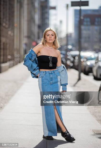 Amelie Stanescu is seen wearing denim Blanche CPH skirt with slit, Selected Femme Jacket, black off shoulder Weekday top, Vagabond shoes, Le Specs...