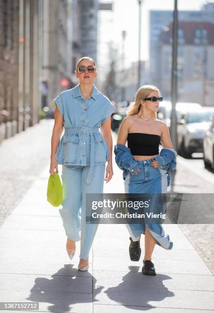 Tina Haase is seen wearing Selected Femme Denim vest & wide leg jeans, Mango crystal clear perspex heels, Loewe sunglasses, &other stories lemon...