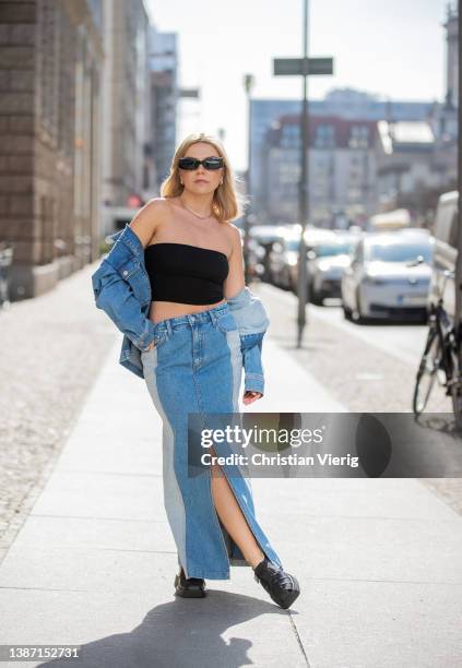 Amelie Stanescu is seen wearing denim Blanche CPH skirt with slit, Selected Femme Jacket, black off shoulder Weekday top, Vagabond shoes, Le Specs...