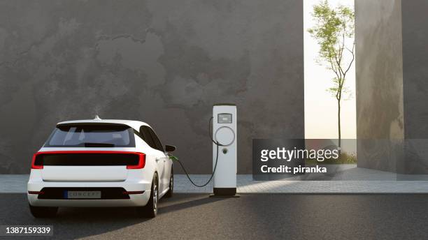 electric vehicle charging - electric cars stockfoto's en -beelden
