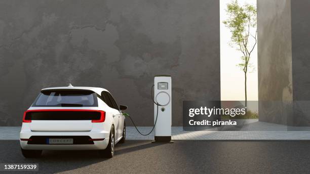 electric vehicle charging - electric vehicle stock pictures, royalty-free photos & images