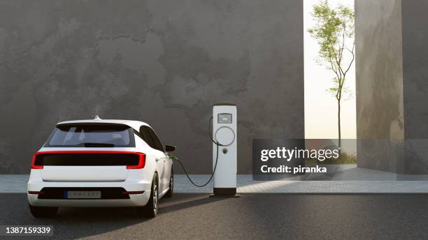 electric vehicle charging - electric vehicle charging station stock pictures, royalty-free photos & images