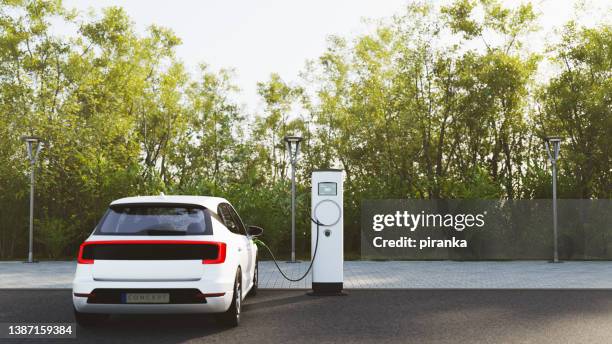 electric vehicle charging - electrical component imagens e fotografias de stock