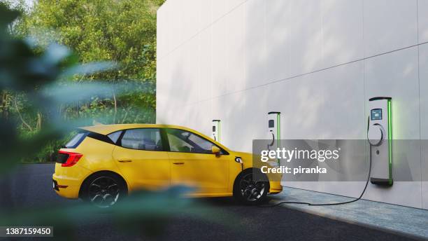 electric vehicle charging station - charging station stock pictures, royalty-free photos & images