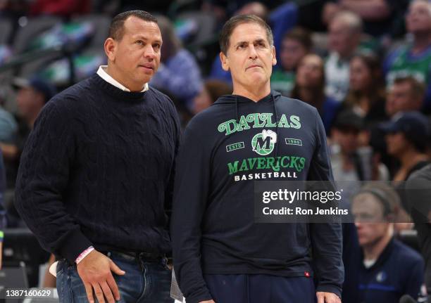 Former professional baseball player and cast member of Shark Tank Alex Rodriguez speaks with Dallas Mavericks owner Mark Cuban before the game...