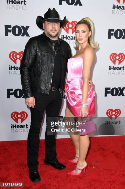 Jason Aldean and Brittany Kerr attend the 2022 iHeartRadio Music Awards at The Shrine Auditorium in Los Angeles, California on March 22, 2022....