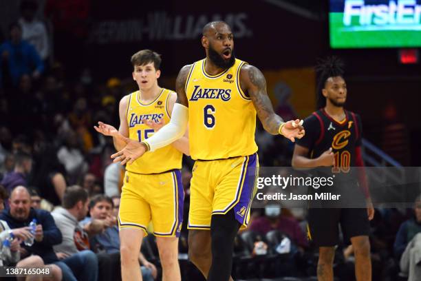 Austin Reaves and LeBron James of the Los Angeles Lakers react during the third quarter against the Cleveland Cavaliers at Rocket Mortgage Fieldhouse...