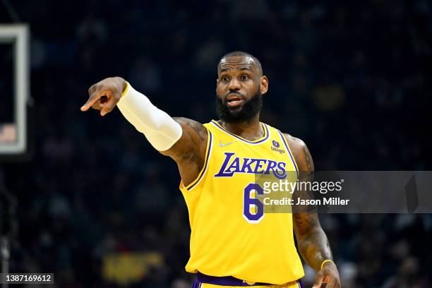LeBron James of the Los Angeles Lakers signals to his teammates during the first quarter against the Cleveland Cavaliers at Rocket Mortgage...