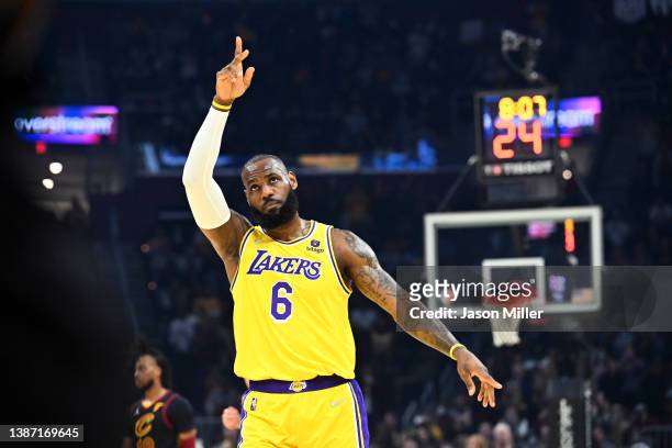 LeBron James of the Los Angeles Lakers waves to the crowd during the first quarter against the Cleveland Cavaliers at Rocket Mortgage Fieldhouse on...