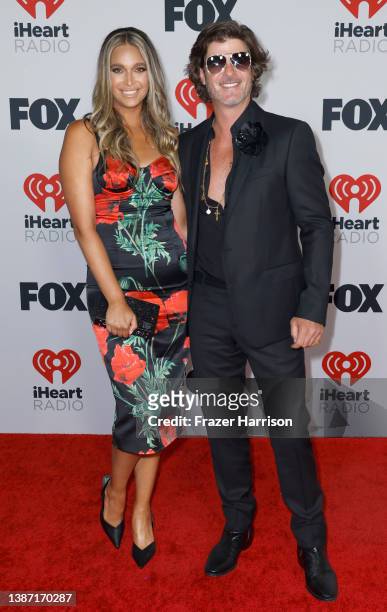 April Love Geary and Robin Thicke attend the 2022 iHeartRadio Music Awards at The Shrine Auditorium in Los Angeles, California on March 22, 2022.