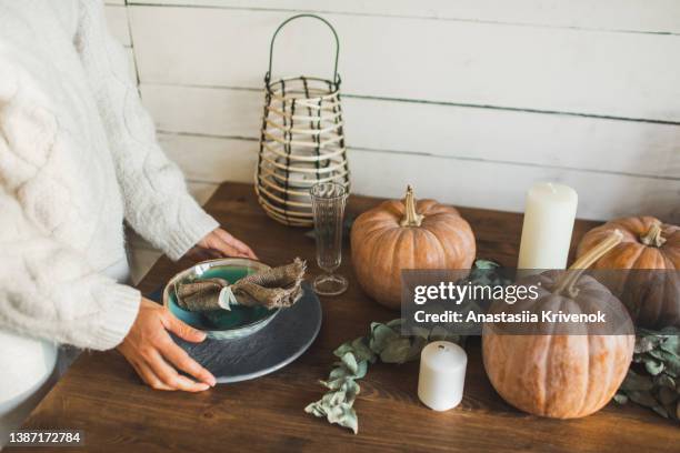 fall themed holiday table setting arrangement for a seasonal party. - pumpkin decorating stock pictures, royalty-free photos & images