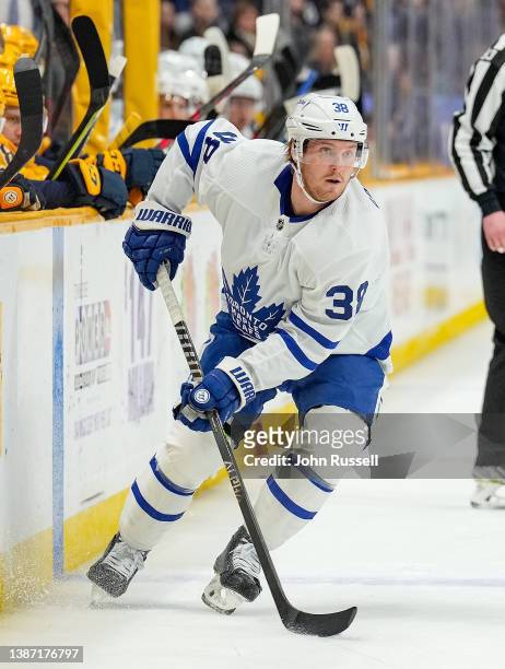 Rasmus Sandin of the Toronto Maple Leafs skates against the Nashville Predators during an NHL game at Bridgestone Arena on March 19, 2022 in...