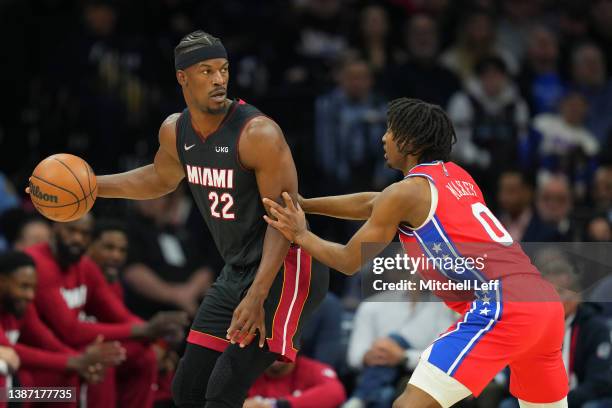 Jimmy Butler of the Miami Heat dribbles the ball against Tyrese Maxey of the Philadelphia 76ers at the Wells Fargo Center on March 21, 2022 in...