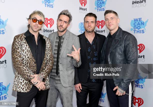 Alex Gaskarth, Jack Barakat, Robert Rian Dawson and Zack Merrick of All Time Low attend the 2022 iHeartRadio Music Awards at The Shrine Auditorium in...