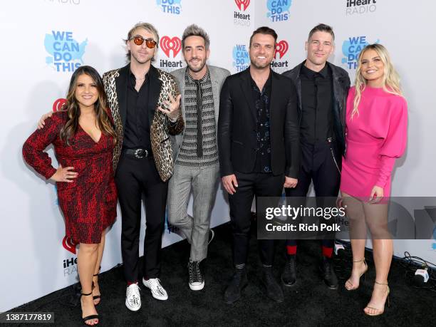 Sisanie, Alex Gaskarth, Jack Barakat, Robert Rian Dawson and Zack Merrick of All Time Low and Tanya Rad attend the 2022 iHeartRadio Music Awards at...