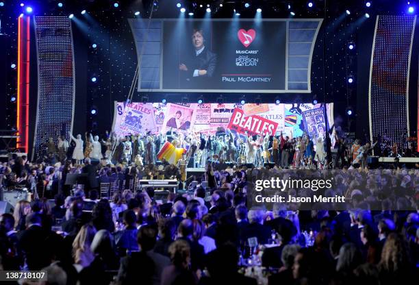 The cast of the Beatles "LOVE" by Cirque du Soleil perform onstage at the 2012 MusiCares Person of the Year Tribute to Paul McCartney held at the Los...