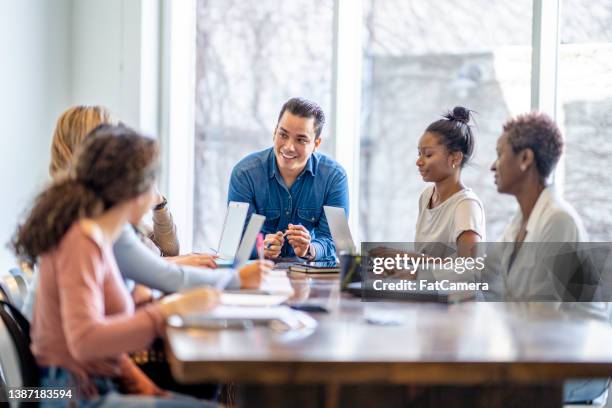 university students working together - financial literacy stock pictures, royalty-free photos & images