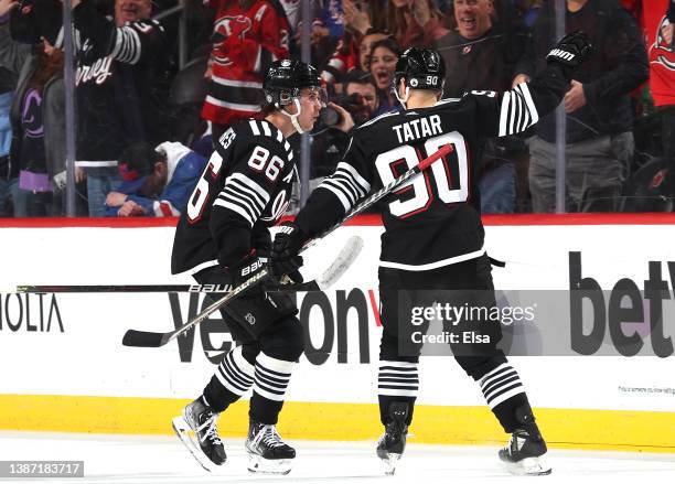 Jack Hughes of the New Jersey Devils celebrates his goal with teammate Tomas Tatar during the third period against the New York Rangers at Prudential...