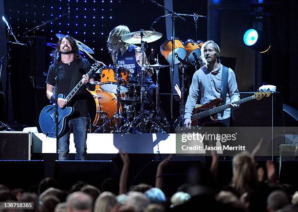 Musicians Dave Grohl and Nate Mendel of the Foo Fighters perform onstage at the 2012 MusiCares Person of the Year Tribute to Paul McCartney held at...