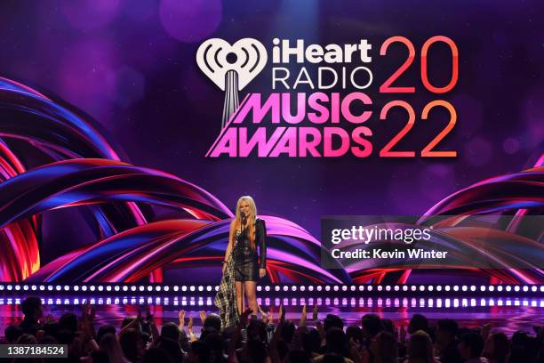 Avril Lavigne speaks onstage at the 2022 iHeartRadio Music Awards at The Shrine Auditorium in Los Angeles, California on March 22, 2022. Broadcasted...