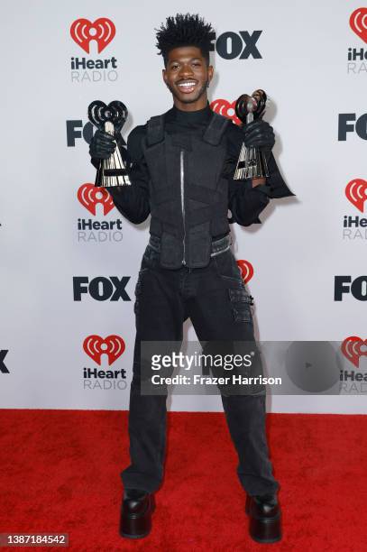 Lil Nas X, winner of Male Artist of the Year and iHeartRadio Hat Trick, poses in the press room at the 2022 iHeartRadio Music Awards at The Shrine...